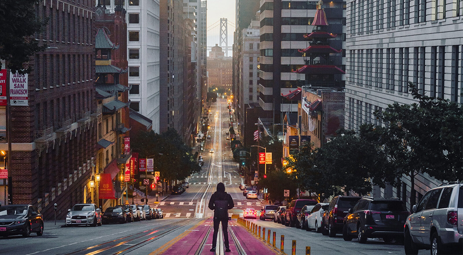 man standing in middle of street