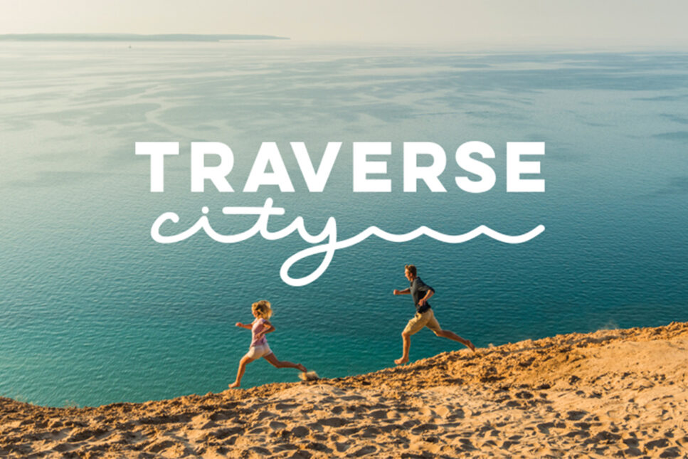 two people running on beach