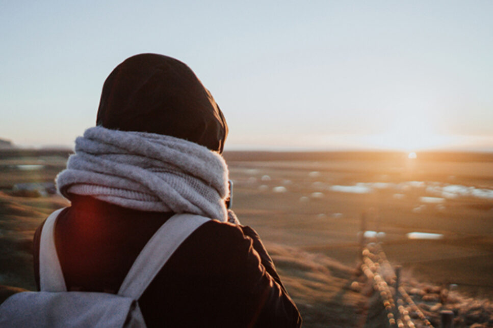 girl looking into sunset